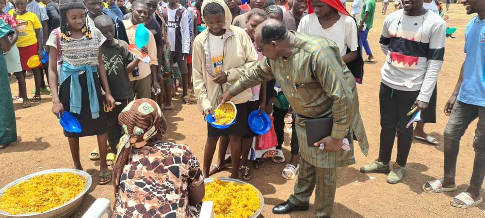 Community meal being served to children and youth