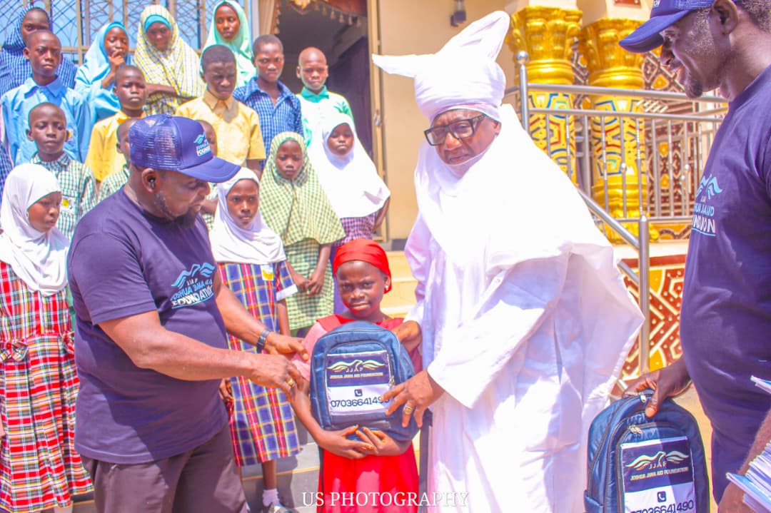 School supplies presented to a pupil with a traditional ruler